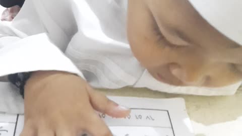 he is reading the qur'an