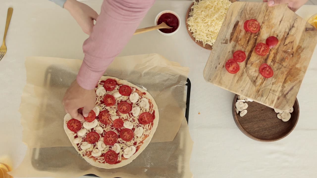 Overhead Shot of People Making Pizza