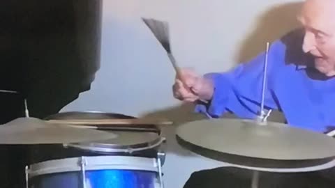 102 yr old drummer still has the groove .