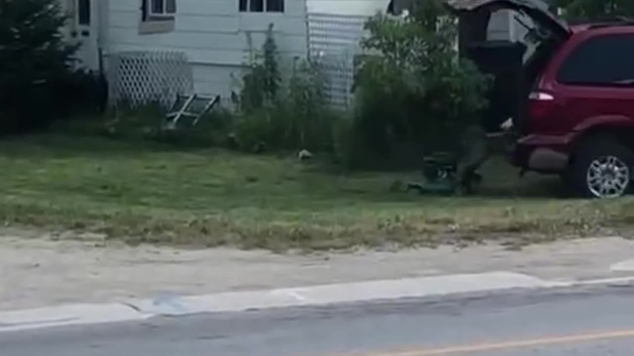 THIS IS HILARIOUS A MAN HOOKS UP HIS LAWNMOWER TO THE BACK OF HIS TRUCK TO MOW THE LAWN