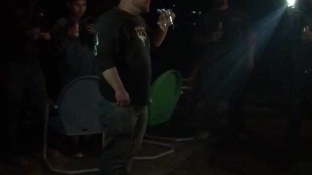 Guy in blue blowing fire out