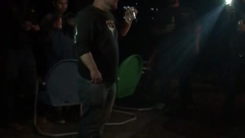 Guy in blue blowing fire out