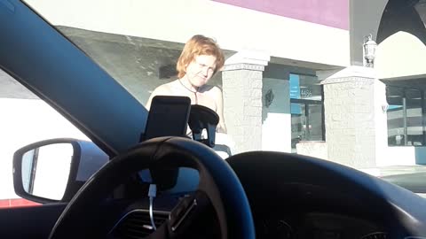 Woman Crosses Street Wearing Towel