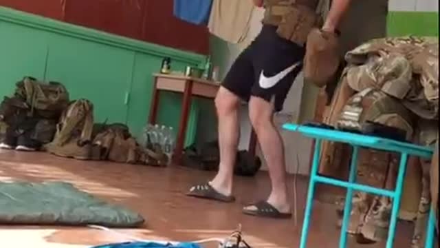 Ukraine soldiers using a school as shelter and to store weapons