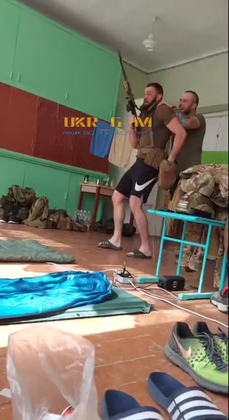 Ukraine soldiers using a school as shelter and to store weapons