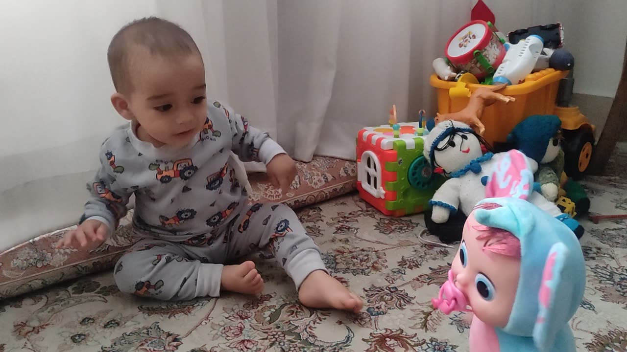 Cute baby and scary toy