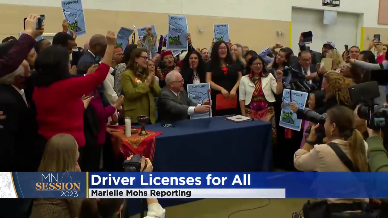 Tim Walz signing a law to give driver’s licenses to illegal aliens.