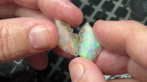 Slicing an opal to reveal amazing color inside