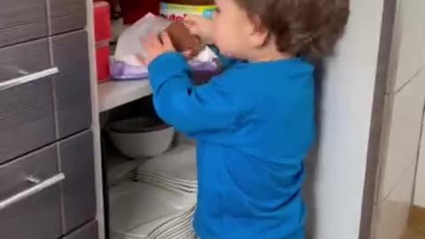 boy discovers hidden chocolate and runs off immediately with him