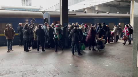 Civilians flee Kyiv, the capital of Ukraine.