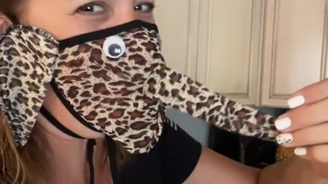 Funny woman using wrong mask