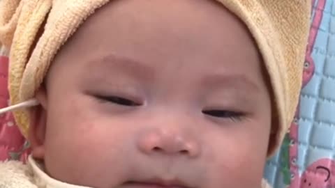 Baby Enjoying ear cleaning