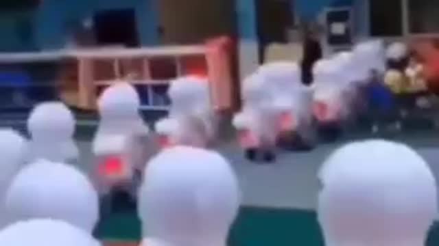HARD - Children in China wearing full Hazmat suits in schools