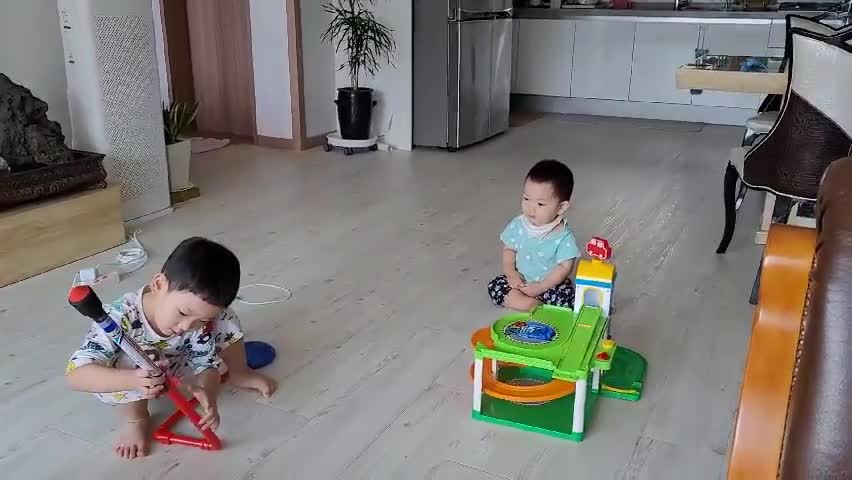 This is a video of babies playing with toy rockets.