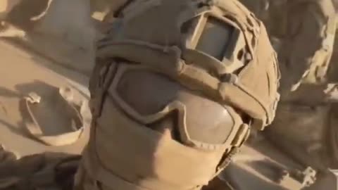 Russian soldiers driving through a dusty road somewhere in the SMO zone