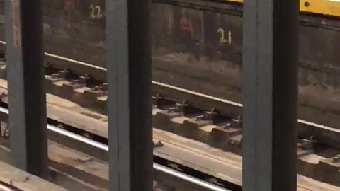 Brown jacket white shoe guys dances in subway terminal