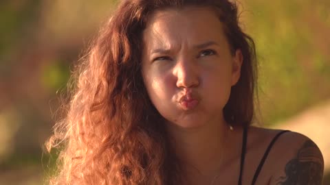 Charming young girl is making cheerful face