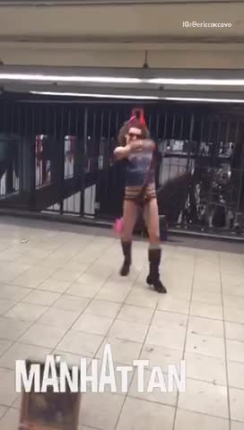 Man with devil horns and open underwear dances in subway station