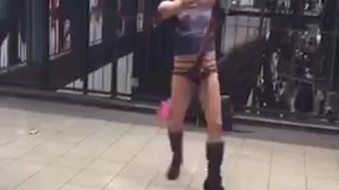 Man with devil horns and open underwear dances in subway station