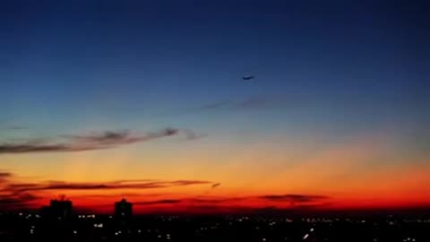 Airplane On Sunset Sky