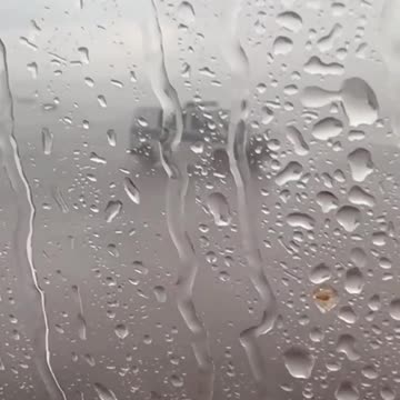 andrew tate in the private plane while rain