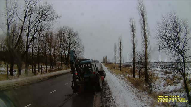 Tractor Wheel Wipes out Passing Car