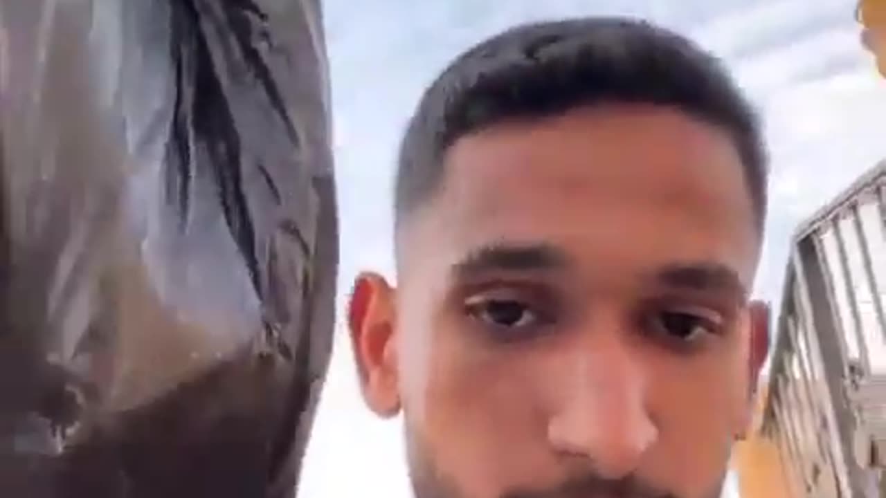 azan man throws food in the garbage because it was parachuted into Gaza by the US Air Force