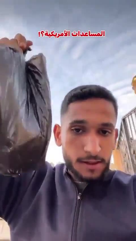 azan man throws food in the garbage because it was parachuted into Gaza by the US Air Force