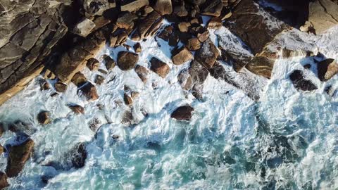 Ocean waves wash stones