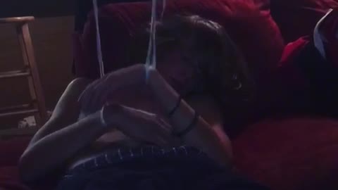Music guy sleeping strings attached to arms and moving them