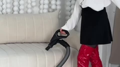 Vacuuming in red leather boots
