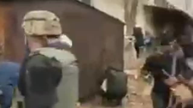 Civilians picking up weapons in Ukraine.