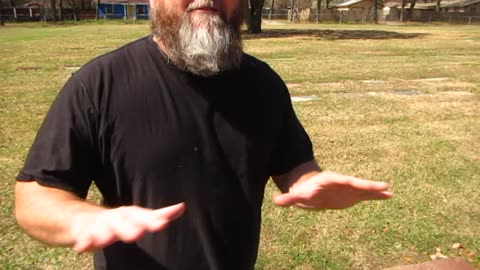 Roger Roots at Lee Harvey Oswald's grave (Fort Worth, Texas)