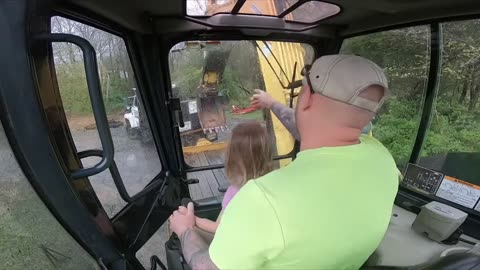 Giving the next generation lessons in loading an excavator on a trailer