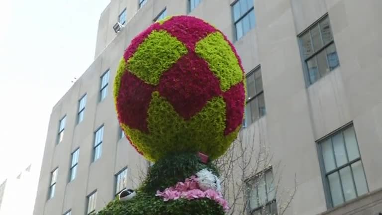 A giant floral Easter bunny is planted on Fifth Avenue in New York