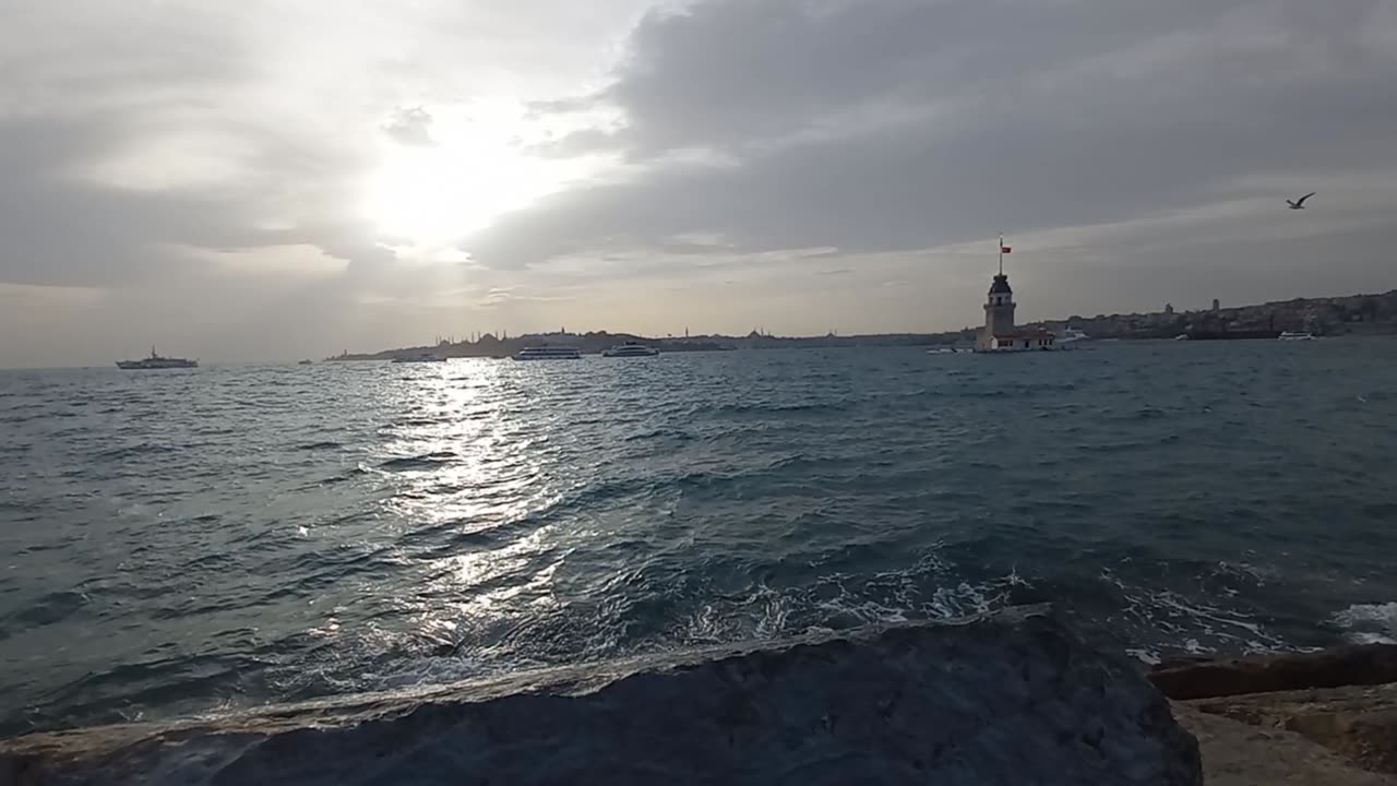 Beautiful landscape at sunset and waves in the sea