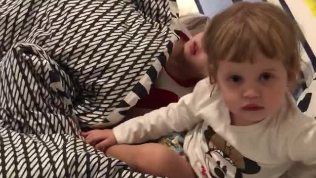 Aussie babies playing on the bed