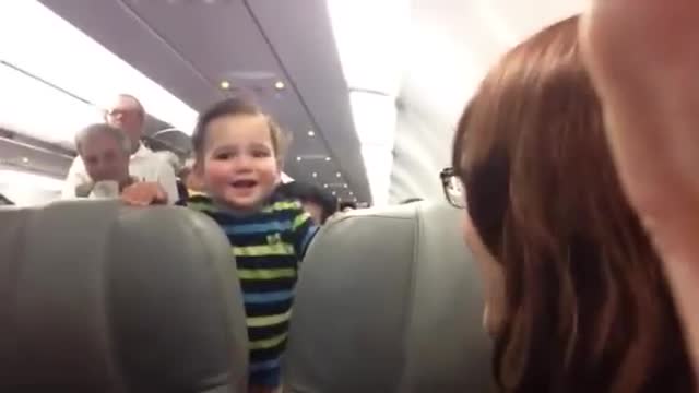 Laughing baby on airplance - so cute