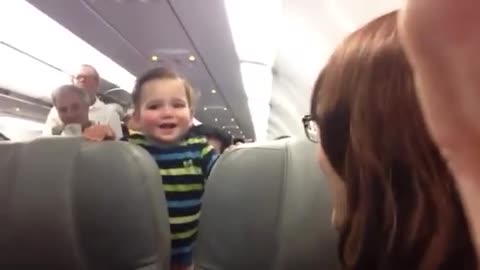 Laughing baby on airplance - so cute