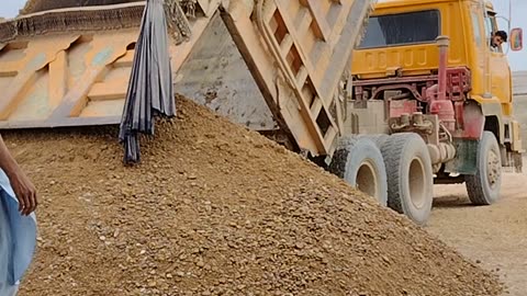 Unloading mix sand on our blocks making plant