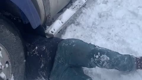 Mechanic Working on Semi in the Snow Gets Stuck