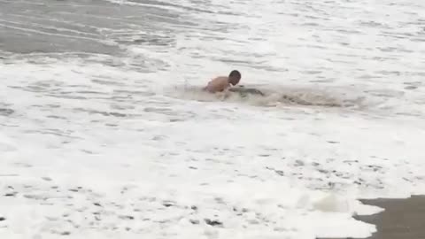 Collab copyright protection - blue trunks orange board hits wave