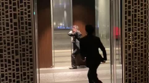 Hotel Staff Battle Typhoon Winds to Close Doors