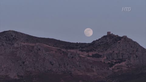 Flower Moon Hangs Over Ruins of Corinth