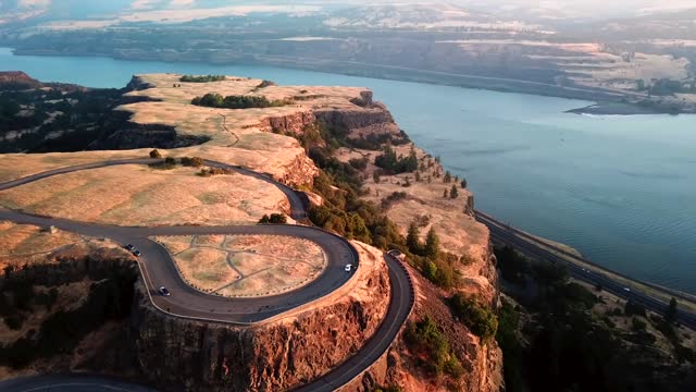 A long And winding road going up the mountain rock