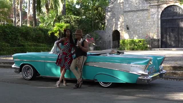 COUPLE WITH CLASSIC CAR