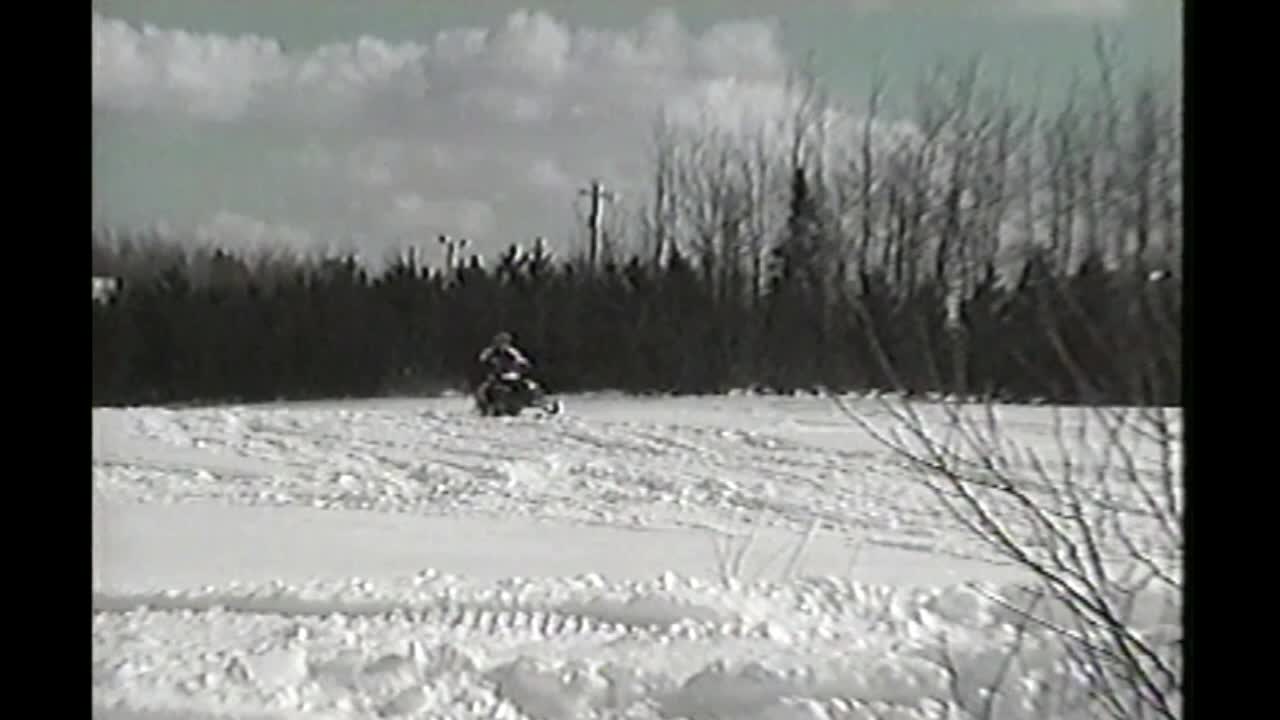 Guy Jumps Snowmobile Off House And Crashes Hard