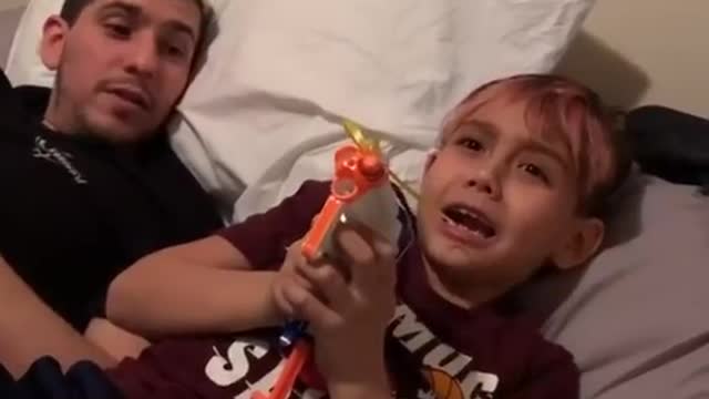 Kid uses Nerf gun to pull his loose tooth out