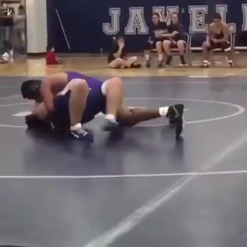 Wrestling ref slides across floor
