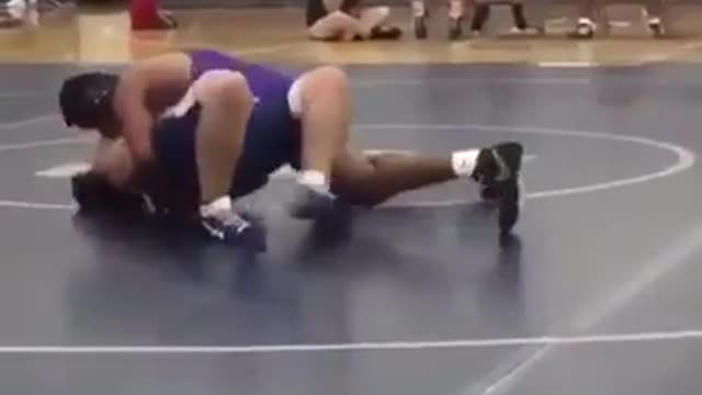 Wrestling ref slides across floor